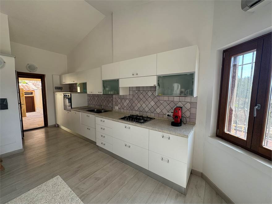 Entrance with kitchen on the first floor