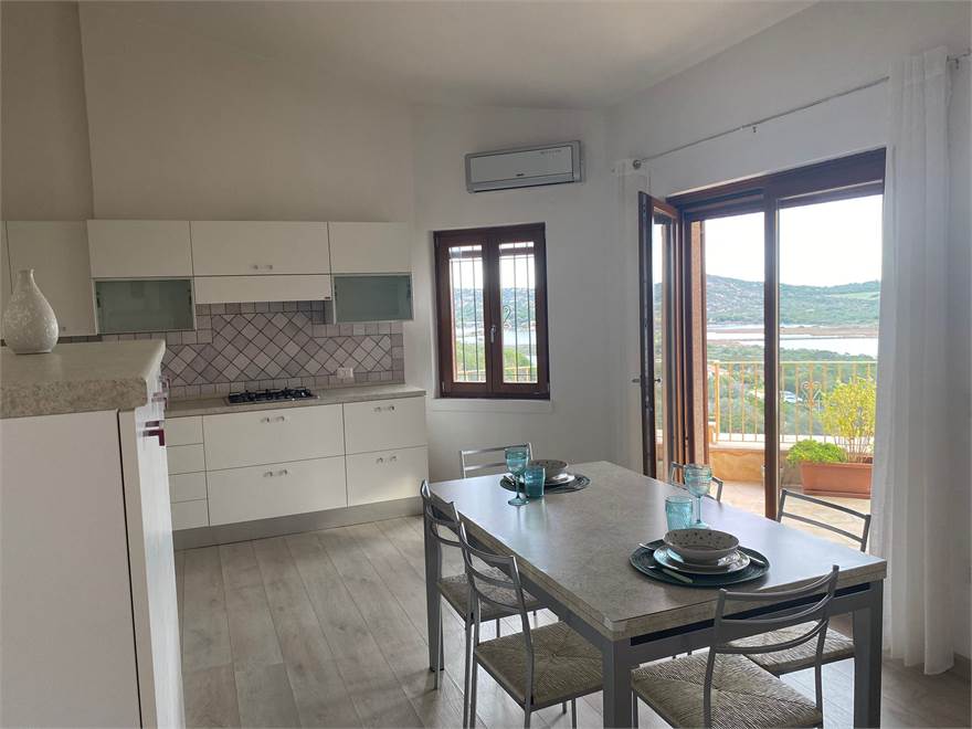 Dining area opening to the balcony